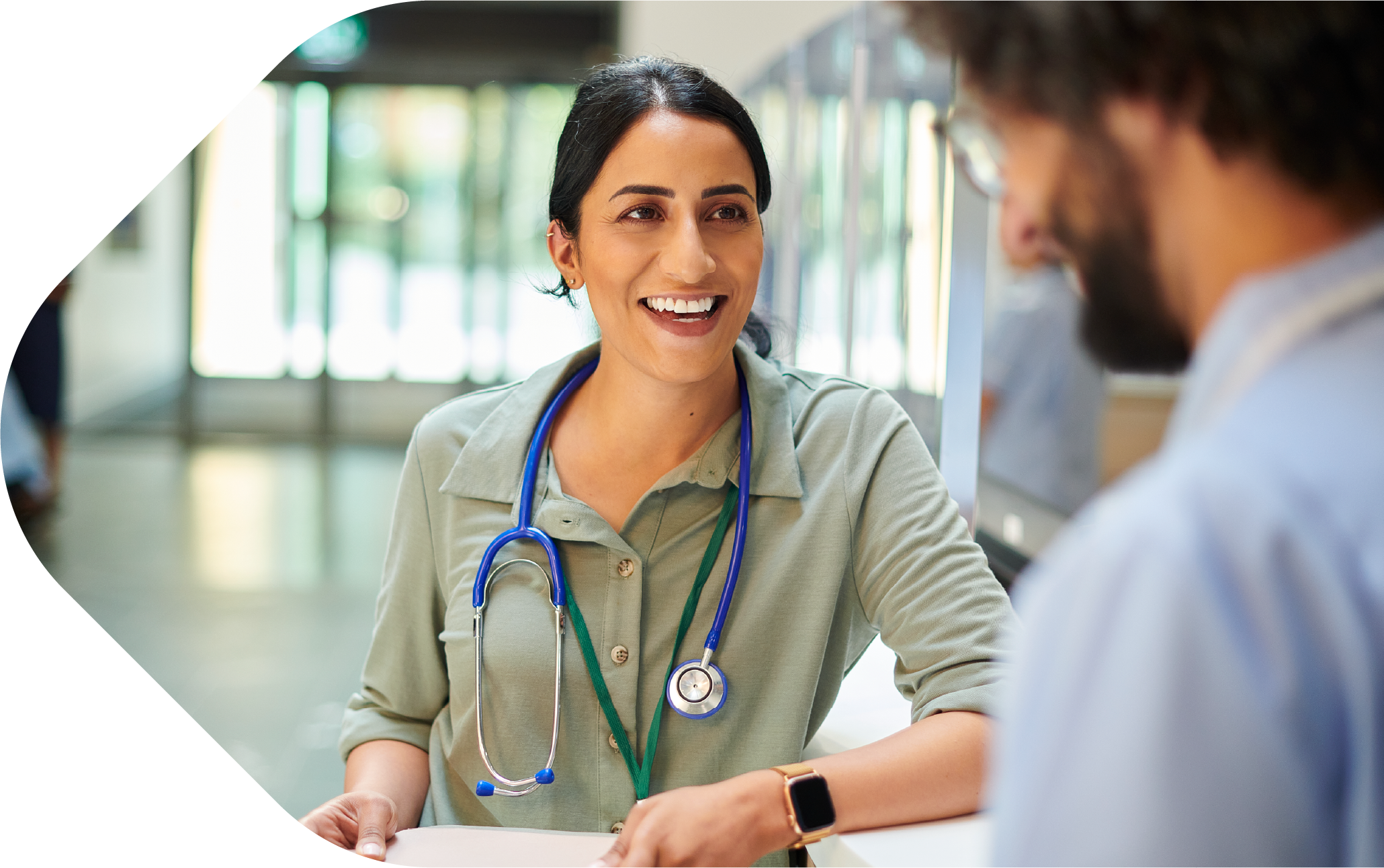 GP talking to colleague in hospital