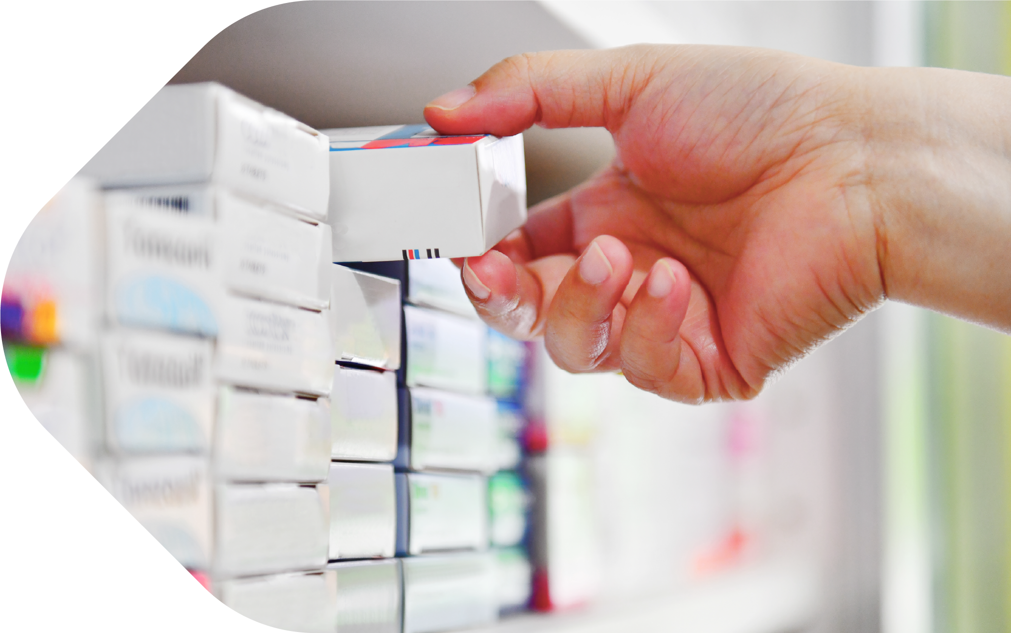Hand taking medicine packet from shelf